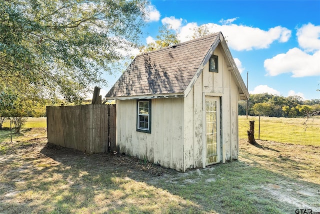 view of outbuilding with a lawn