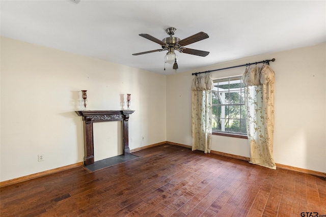 unfurnished living room featuring hardwood / wood-style flooring and ceiling fan