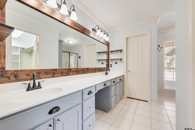 bathroom with tile patterned flooring, ornamental molding, a stall shower, and a sink