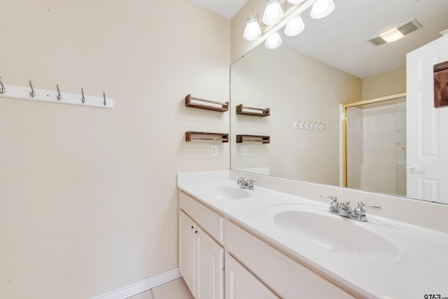 full bathroom with a sink, visible vents, a stall shower, and double vanity