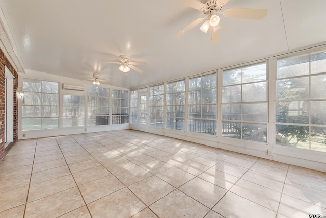 unfurnished sunroom with a ceiling fan and a wall unit AC