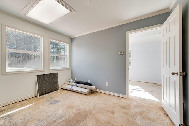 unfurnished room with crown molding and baseboards