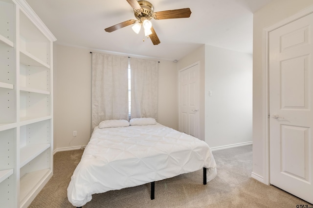 bedroom featuring a ceiling fan, baseboards, and carpet floors