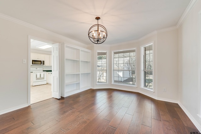 unfurnished dining area with a notable chandelier, dark wood finished floors, and ornamental molding