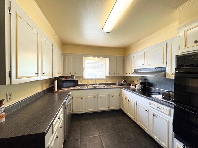 1207 E Redbud Ave, Crockett, TX 75835 - kitchen featuring a sink, under cabinet range hood, dark countertops, black appliances, and dark tile patterned flooring