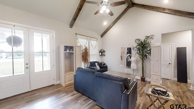 living area with beam ceiling, wood finished floors, french doors, and ceiling fan