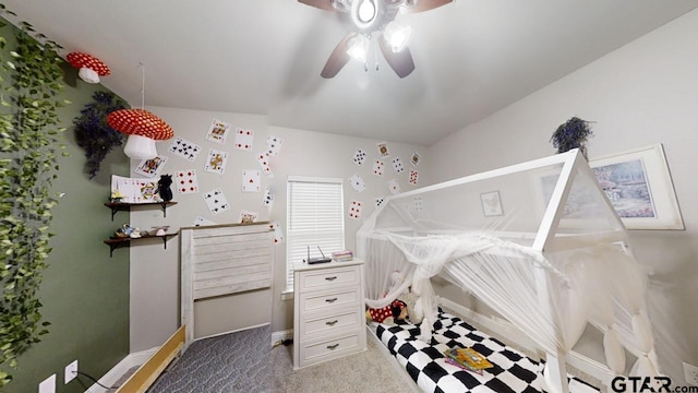 carpeted bedroom with baseboards and a ceiling fan
