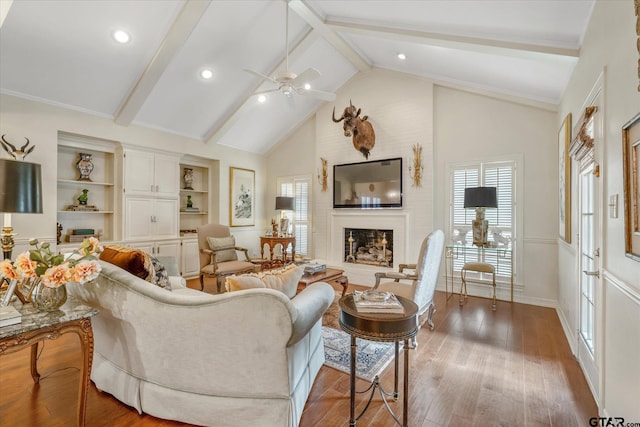 2003 Royal Oak Dr, Tyler, TX 75703 - living room featuring beam ceiling, a fireplace, a ceiling fan, wood finished floors, and high vaulted ceiling