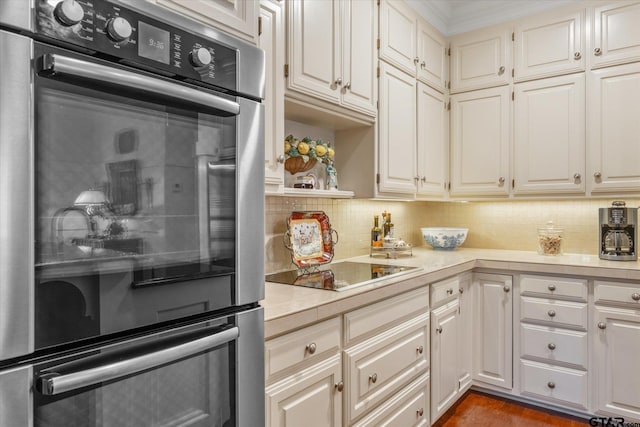 2003 Royal Oak Dr, Tyler, TX 75703 - kitchen featuring stainless steel double oven, light countertops, backsplash, open shelves, and white cabinetry