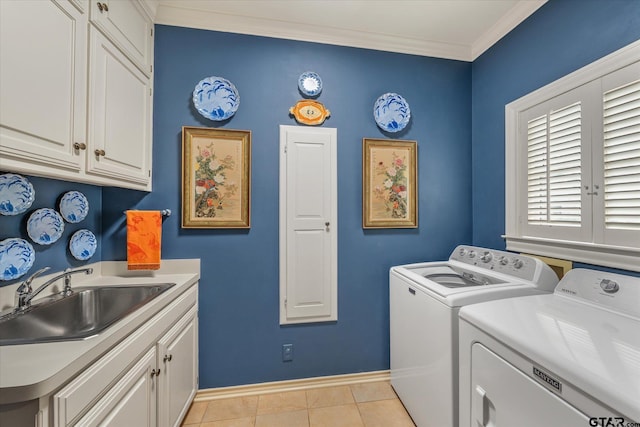 2003 Royal Oak Dr, Tyler, TX 75703 - washroom featuring washer and dryer, crown molding, cabinet space, baseboards, and light tile patterned floors
