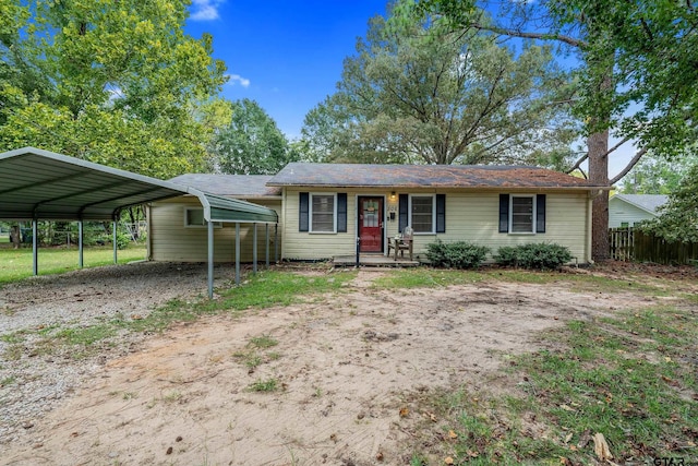 ranch-style home with a carport