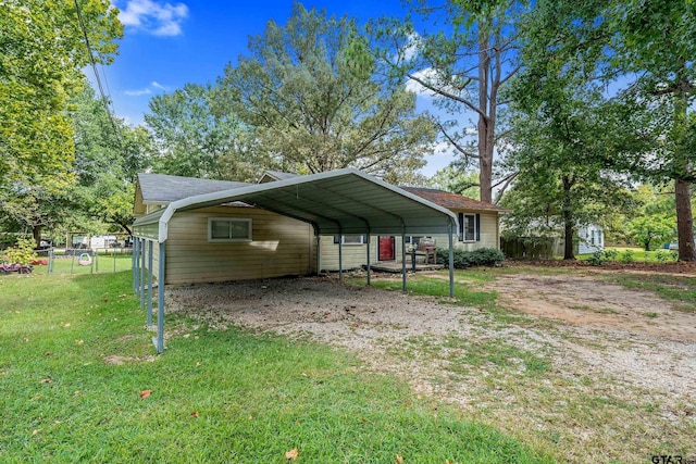 view of vehicle parking featuring a carport and a lawn