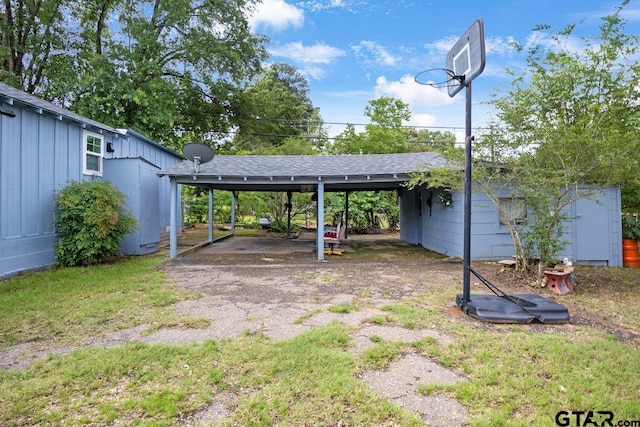 2200 N Horn Ave, Tyler, TX 75702 - view of yard with a detached carport, an outbuilding, and driveway