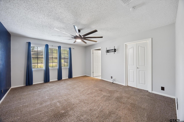 223 Guadalupe Dr, Athens, TX 75751 - carpeted empty room featuring ceiling fan, baseboards, and a textured ceiling