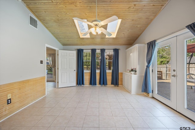223 Guadalupe Dr, Athens, TX 75751 - spare room featuring wooden ceiling, vaulted ceiling, light tile patterned floors, plenty of natural light, and a ceiling fan