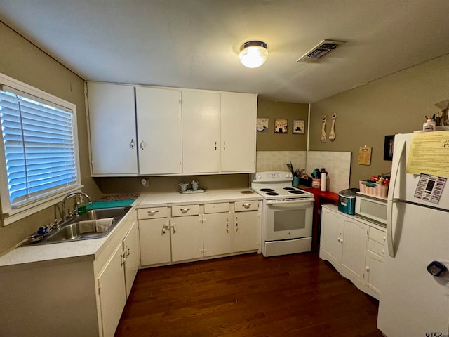 kitchen with white appliances, white cabinetry, sink, and dark hardwood / wood-style flooring