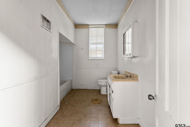 210 S Adams Ave, Tyler, TX 75702 - full bath with vanity, toilet, and a textured ceiling