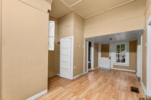 210 S Adams Ave, Tyler, TX 75702 - spare room featuring baseboards, light wood-style floors, and visible vents