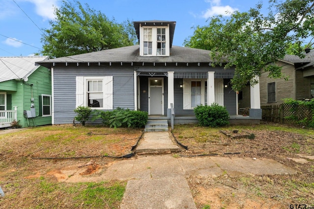 210 S Adams Ave, Tyler, TX 75702 - view of front of home with a porch, roof with shingles, and fence
