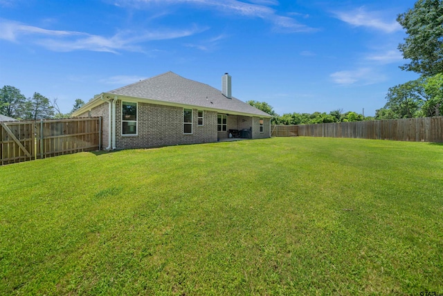 401 Deer Point Cv, Chandler, TX 75758 - rear view of house featuring a chimney, a fenced backyard, and brick siding