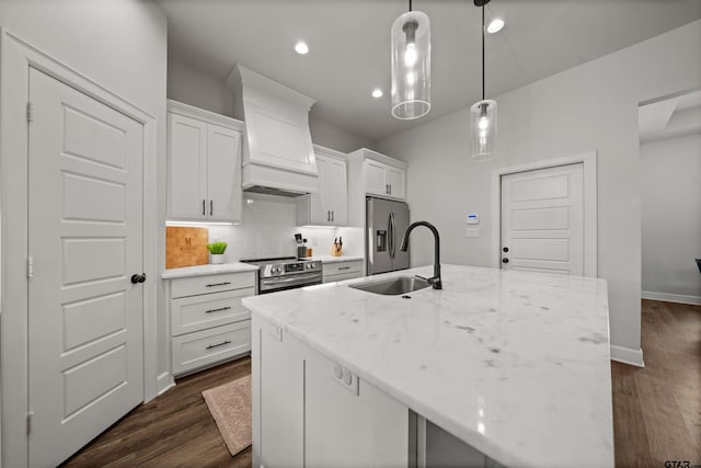 401 Deer Point Cv, Chandler, TX 75758 - kitchen featuring appliances with stainless steel finishes, premium range hood, dark wood-type flooring, white cabinetry, and recessed lighting