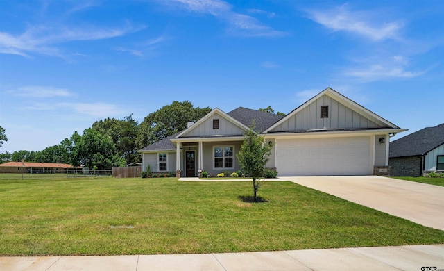 401 Deer Point Cv, Chandler, TX 75758 - view of front of property with board and batten siding, concrete driveway, and a garage