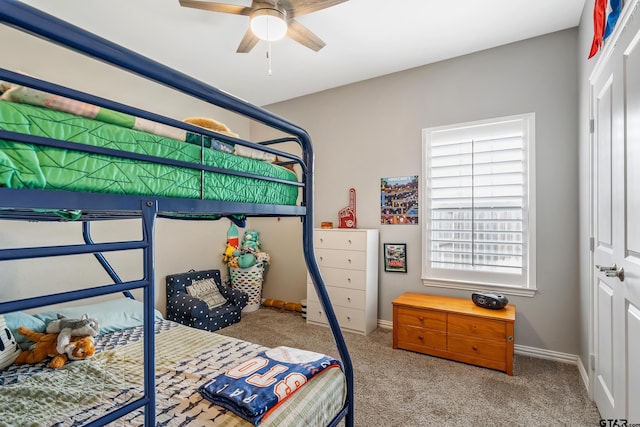 bedroom featuring light colored carpet and a closet