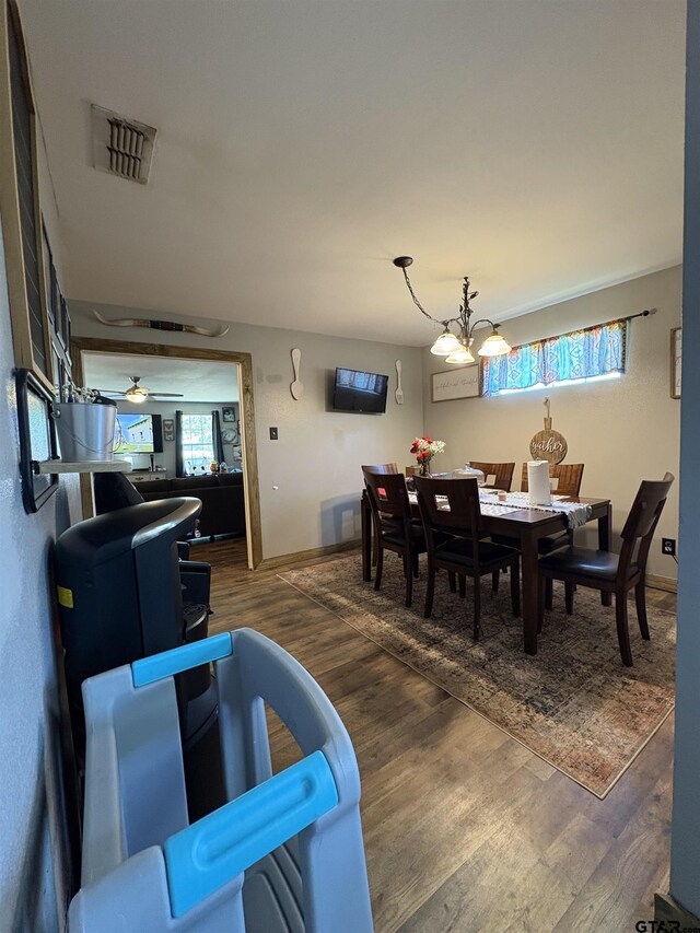 9394 Grape Ave, Frankston, TX 75763 - dining space featuring wood finished floors, healthy amount of natural light, and baseboards