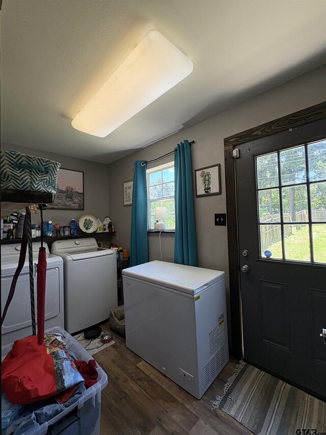 9394 Grape Ave, Frankston, TX 75763 - laundry area with dark wood-style flooring and separate washer and dryer