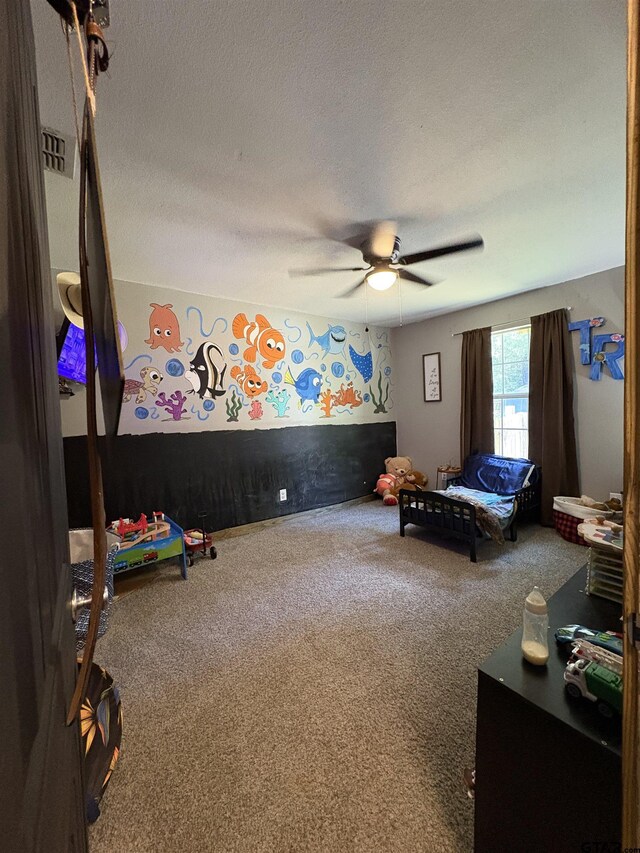 9394 Grape Ave, Frankston, TX 75763 - carpeted bedroom with ceiling fan and a textured ceiling