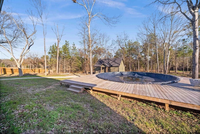 view of yard with a pool side deck