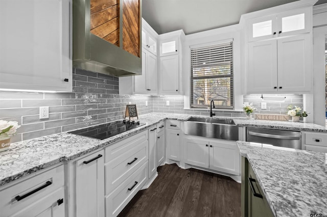 kitchen featuring wall chimney exhaust hood, black electric cooktop, dark wood-type flooring, sink, and white cabinets