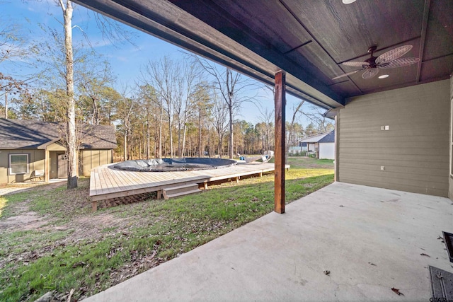 view of patio / terrace with a deck and ceiling fan