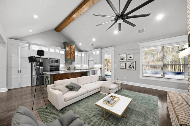 living room featuring vaulted ceiling with beams, ceiling fan, sink, and dark hardwood / wood-style floors