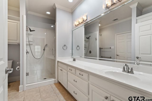 bathroom featuring a stall shower, crown molding, visible vents, and a sink