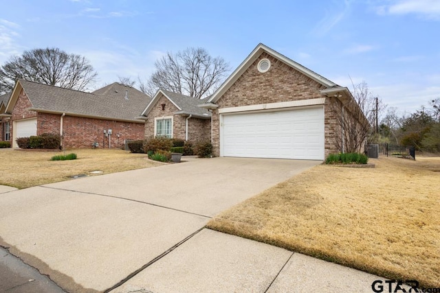 view of front of home with brick siding, concrete driveway, an attached garage, cooling unit, and a front lawn