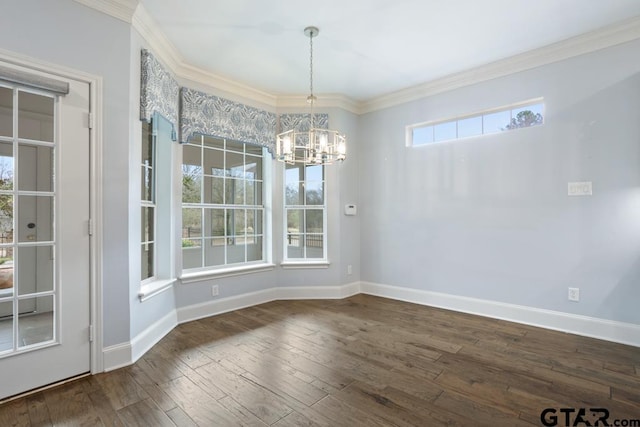 unfurnished dining area with ornamental molding, hardwood / wood-style floors, and baseboards