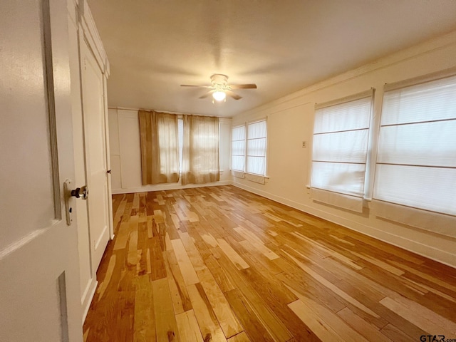 704 W 3rd St, Tyler, TX 75701 - unfurnished room with light wood-style floors, a ceiling fan, and baseboards