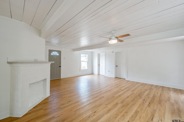 704 W 3rd St, Tyler, TX 75701 - unfurnished living room featuring light wood-type flooring, a ceiling fan, a brick fireplace, baseboards, and wooden ceiling