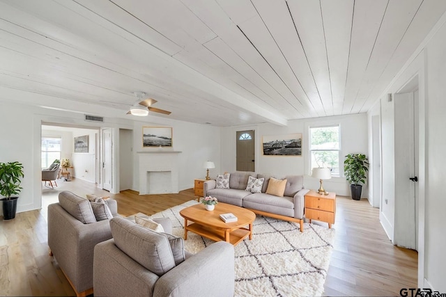 704 W 3rd St, Tyler, TX 75701 - living room featuring light wood-type flooring and a fireplace