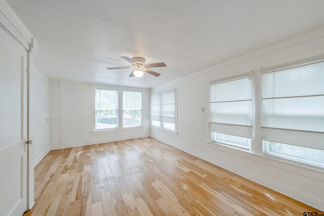 704 W 3rd St, Tyler, TX 75701 - spare room featuring a ceiling fan, light wood finished floors, and baseboards