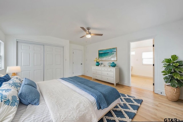 704 W 3rd St, Tyler, TX 75701 - bedroom with light wood finished floors, a closet, ceiling fan, connected bathroom, and baseboards