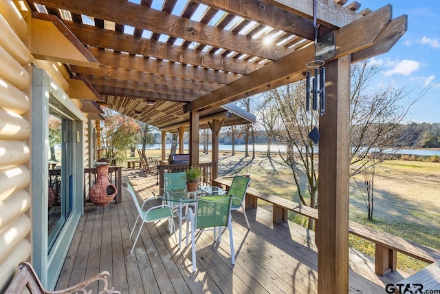 wooden terrace featuring a water view and a pergola