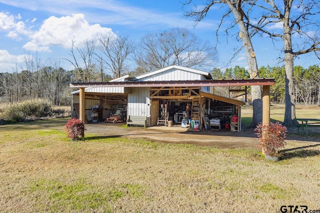 view of outbuilding featuring a yard