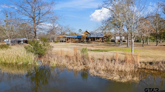 back of house featuring a water view