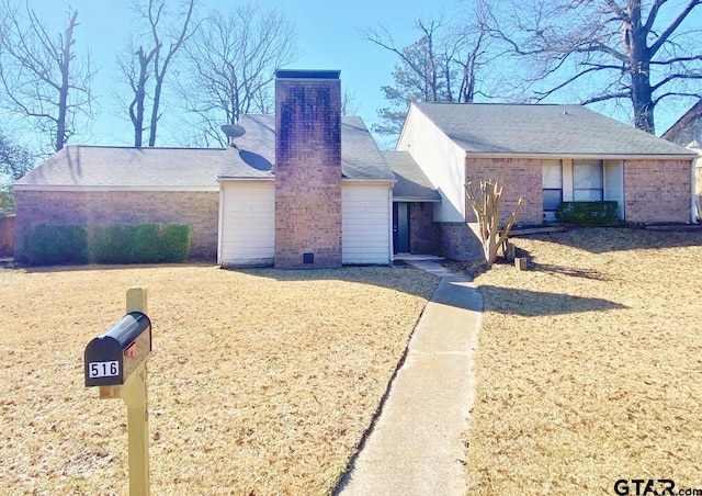 view of front facade with roof with shingles, brick siding, and a chimney