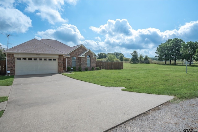 view of front facade with a garage and a front lawn