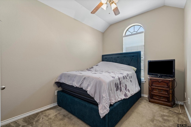 bedroom featuring vaulted ceiling, carpet flooring, and ceiling fan