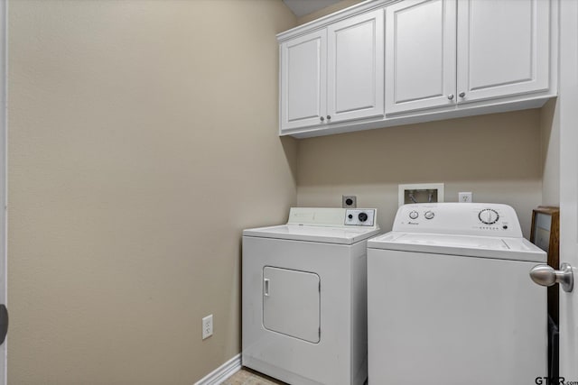 laundry room featuring cabinets and independent washer and dryer