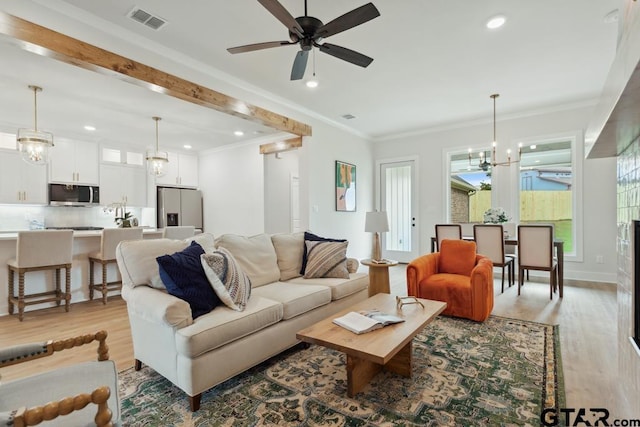 7201 Rolling Acres, Tyler, TX 75707 - living room with light wood-type flooring, ornamental molding, a chandelier, recessed lighting, and a ceiling fan